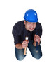 Nervous woodworker holding hammer and chisel