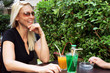 Couple sat drinking on terrace