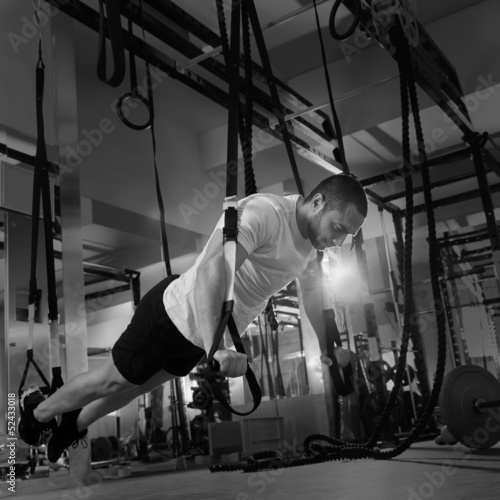 Photo: Crossfit fitness TRX push ups man workout Crossfit fitness TRX push ups man workout
