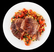 Ribeye steak with stir fried vegetables isolated on black