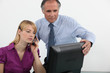 Foto: Businessman and woman at a computer Businessman and woman at a computer