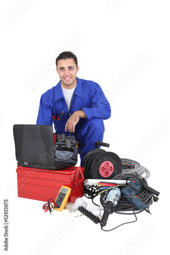 Photo: Electrician with equipment, studio shot Electrician with equipment, studio shot