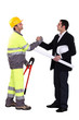 Photo: businessman and craftsman shaking hands businessman and craftsman shaking hands