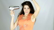 Happy beautiful female model drying hair slow motion