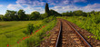 Scenic railroad in rural area in summer