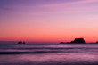 Ship across the ocean at Sunset, in Tofino beach, Canada