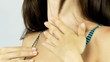 Closeup of woman putting sun cream