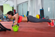 Photo: Crossfit fitness woman push ups Kettlebells pushup exercise Crossfit fitness woman push ups Kettlebells pushup exercise