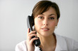 Photo: Woman taking a phone call Woman taking a phone call