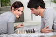 Photo: couple playing chess couple playing chess