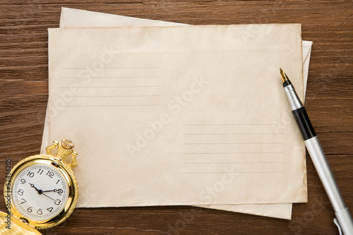 Photo: watch and ink pen at envelope watch and ink pen at envelope