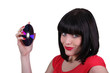 brunette woman showing a compact disc