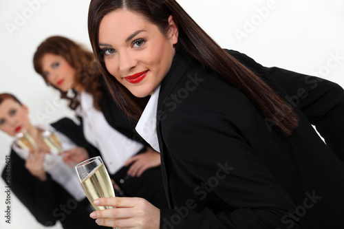 Photo: Three businesswomen drinking champagne Three businesswomen drinking champagne