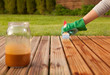 Photo: Painting wooden patio deck with protective varnish Painting wooden patio deck with protective varnish