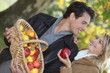 Photo: Couple picking apples Couple picking apples