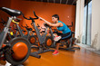 Aerobics spinning woman stretching exercises after workout