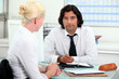 Photo: Businesspeople making a date in the diary Businesspeople making a date in the diary