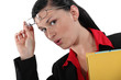 secretary taking off her glasses