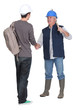 Photo: Manual worker giving new starter a warm welcome Manual worker giving new starter a warm welcome