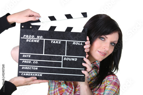 Photo: brunette holding clap brunette holding clap