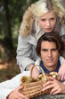 Photo: Couple with basket of chestnuts and mushrooms Couple with basket of chestnuts and mushrooms