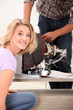Photo: technician repairing a television technician repairing a television