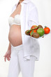 Photo: Pregnant woman with bowl of fruit Pregnant woman with bowl of fruit