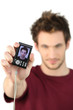 Man showing his portrait on camera
