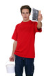 Man holding a scraping tool
