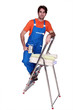 Photo: Man with wallpaper and brush Man with wallpaper and brush