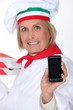 Cook showing phone