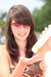 Photo: Girl applying sun cream Girl applying sun cream