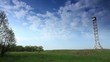 Video: movement of clouds over a field and an observation tower (timela movement of clouds over a field and an observation tower (timela