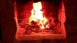 Flame in a fireplace with a dark background