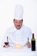 Photo: Chef eating fast-food and drinking wine Chef eating fast-food and drinking wine