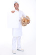 A baker presenting a blank poster.