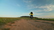 Video: Man riding bicycle through a field Man riding bicycle through a field