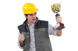 Photo: Male builder holding trophy Male builder holding trophy