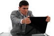 Foto: Businessman alarmed at his laptop Businessman alarmed at his laptop