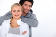 Photo: Couple smiling with arms crossed Couple smiling with arms crossed