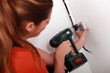 Woman using power drill