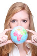 Photo: young woman showing a little globe young woman showing a little globe