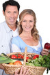 Photo: Couple with vegetable basket. Couple with vegetable basket.