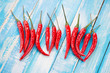 Red chili peppers on wooden boards, view from above
