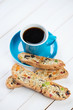 Fresh espresso and italian biscotti on wooden boards