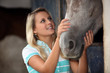 Photo: Teen stroking horse Teen stroking horse