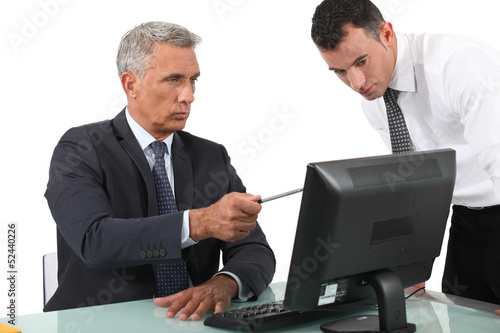 Photo: businessman giving explanations to his boss businessman giving explanations to his boss