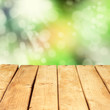 Wooden deck table over beautiful bokeh background