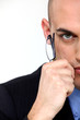 Businessman holding eyeglasses