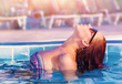 Cute woman in the pool